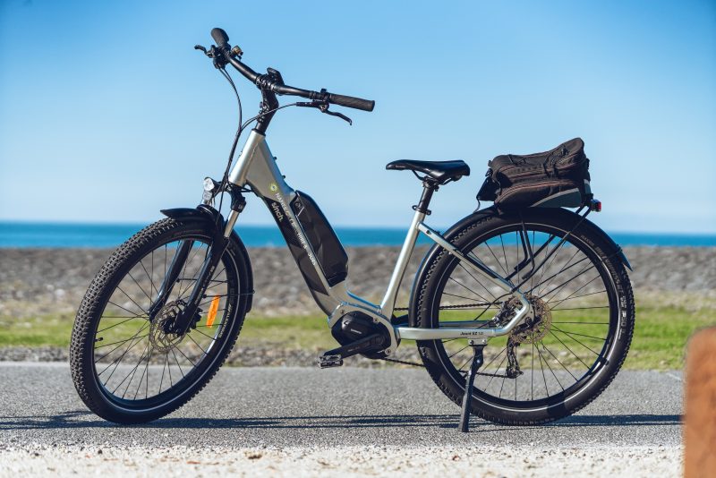 A Sinch e-bike parked above the beach on Marine Parade