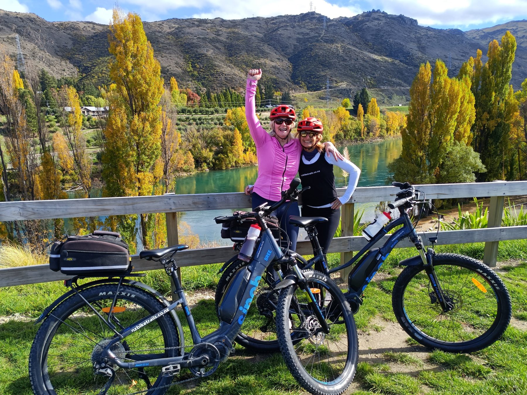 Two riders celebrating at the end of the Lake Dunstan Trail