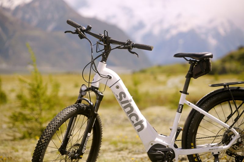 A Sinch e-bike from the Trail Journeys fleet, mountains behind