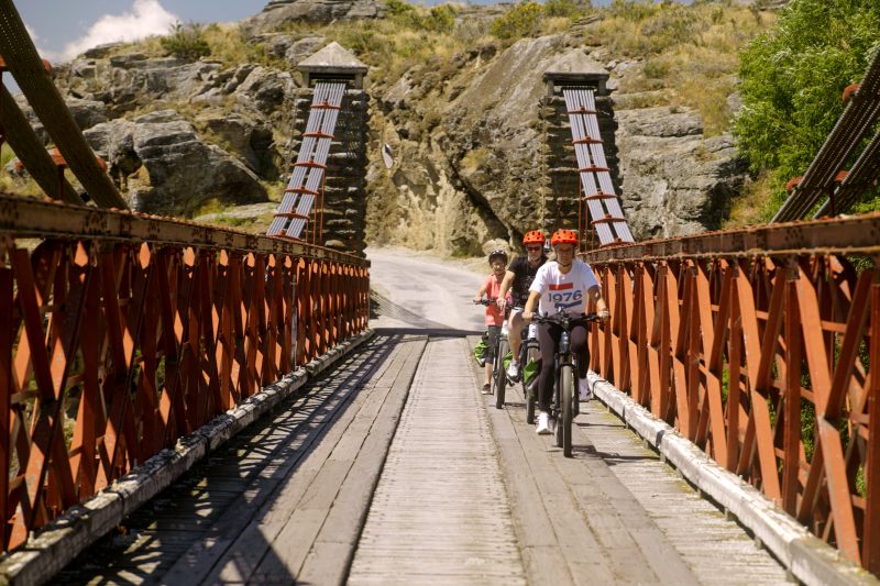 Riders crossing the Ophir bridge on the Otago Central Rail Trail